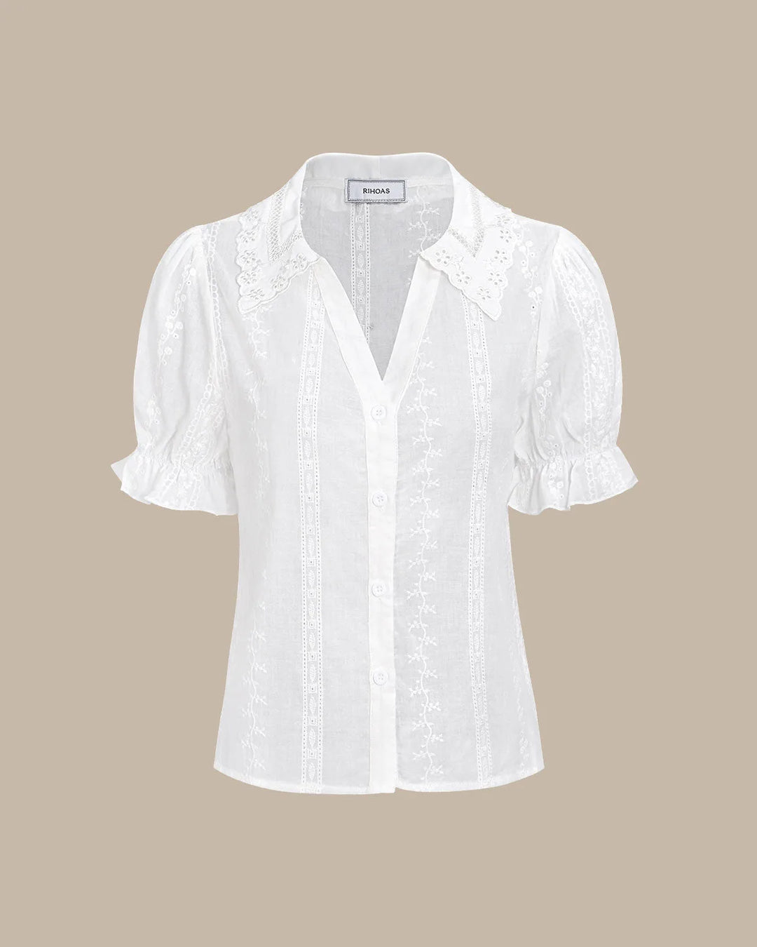 White broderie anglaise blouse on model in full-length styling view