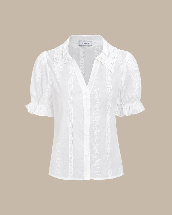 White broderie anglaise blouse on model in full-length styling view