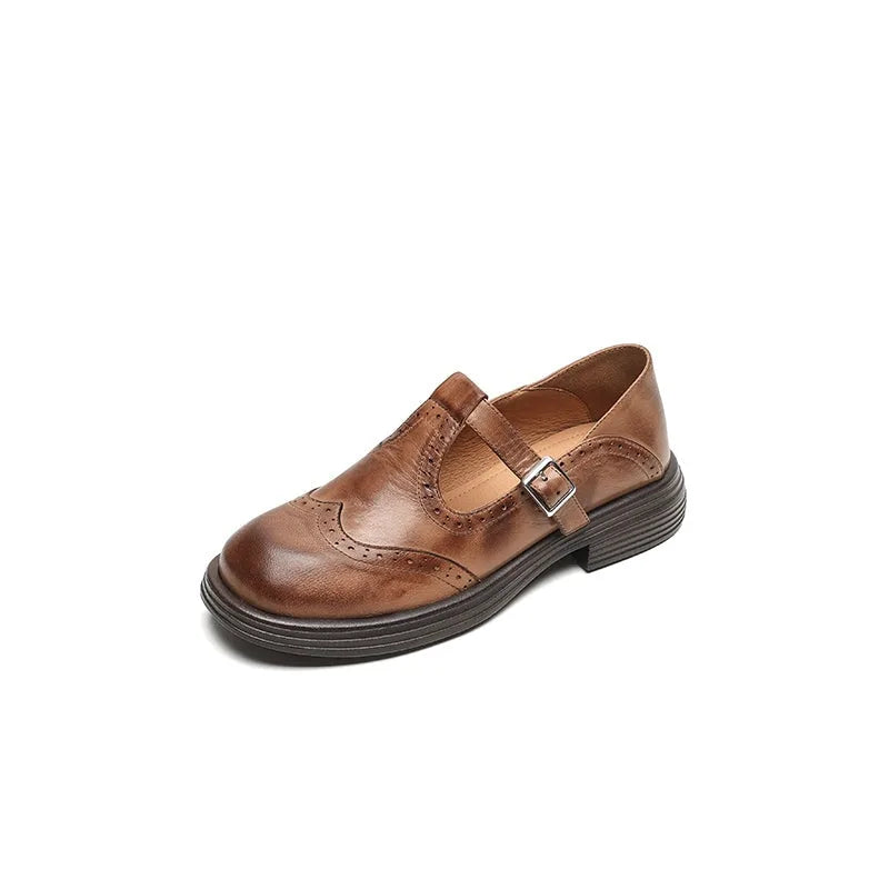 Brown leather brogue Mary Jane shoe with perforated detailing, front view