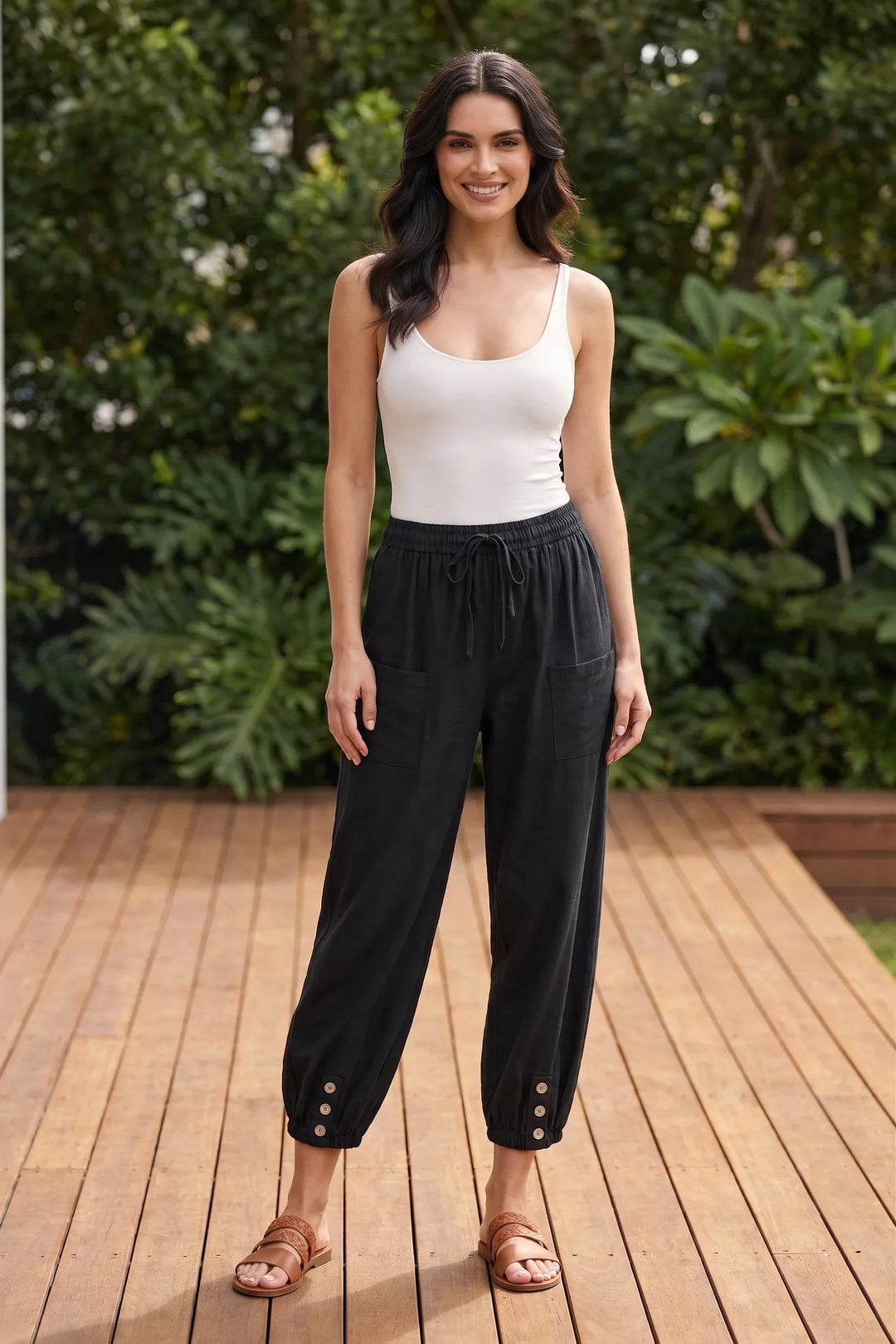 Model wearing black drawstring jogger pants in a casual lifestyle setting