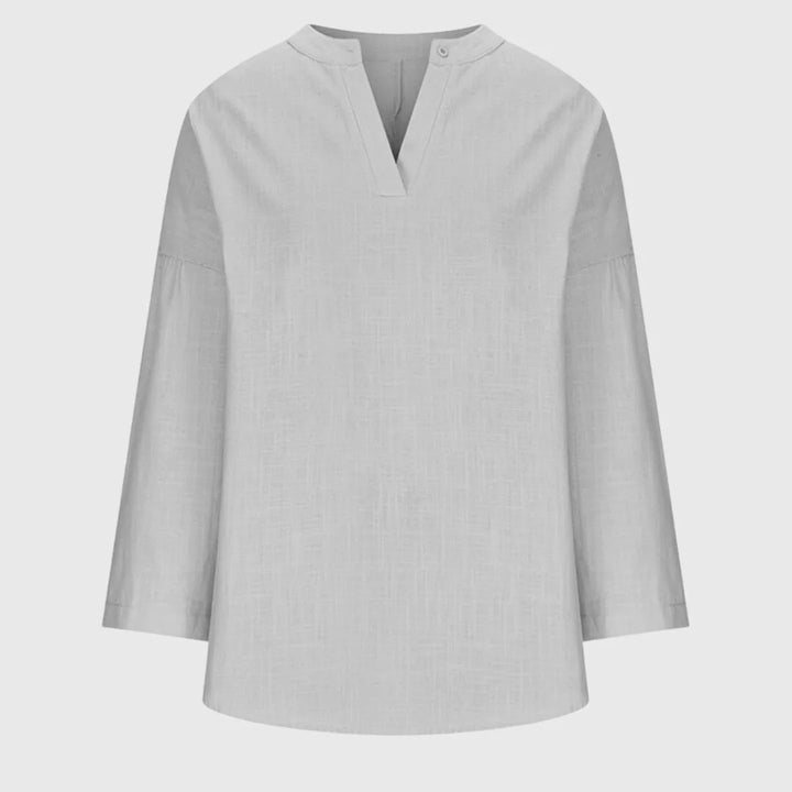 Light blue v-neck tunic blouse on model