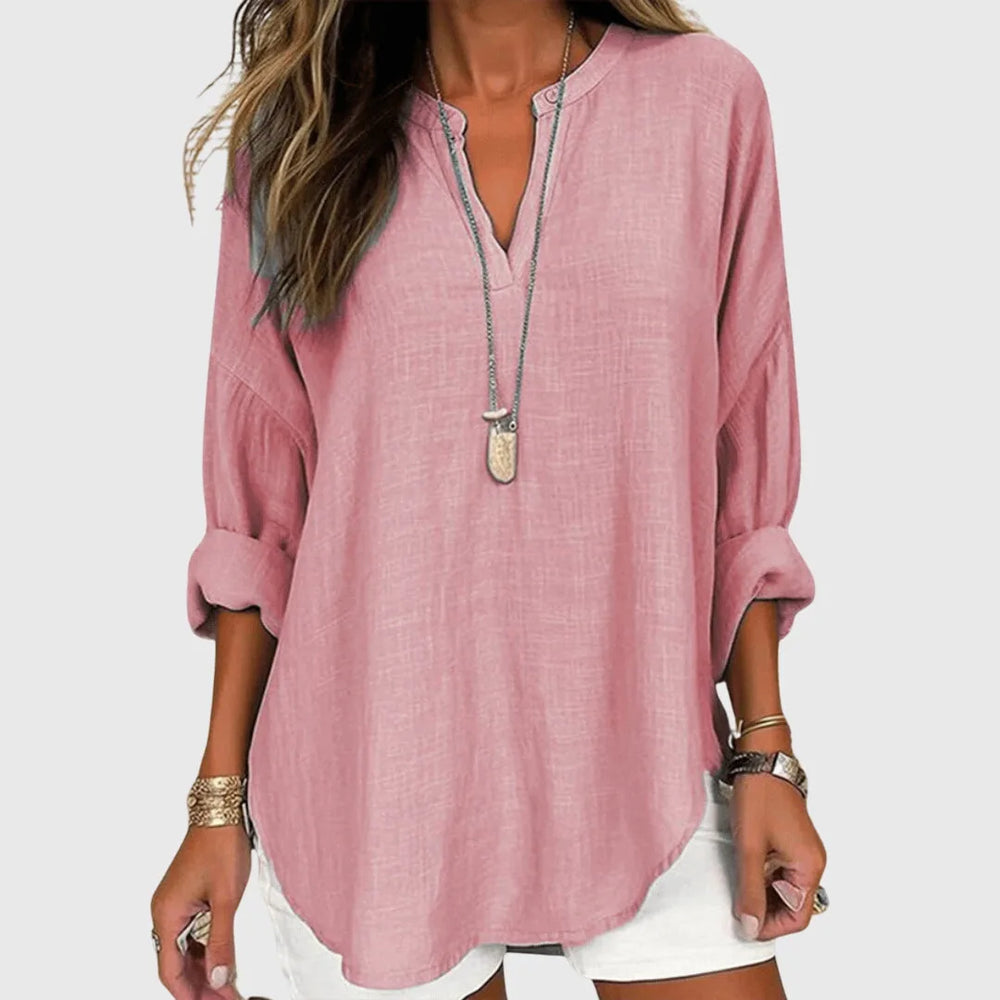 Pink v-neck tunic blouse close-up detail of fabric and neckline