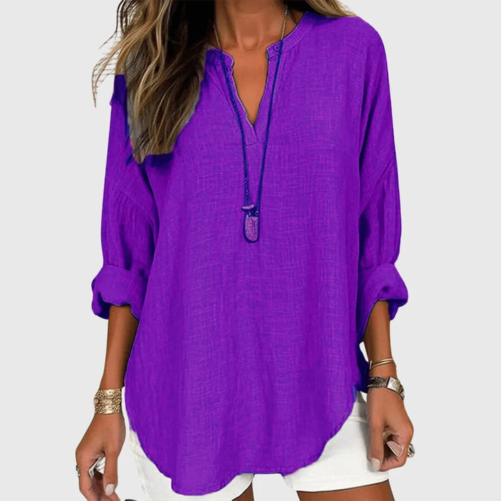 Purple v-neck tunic blouse on model