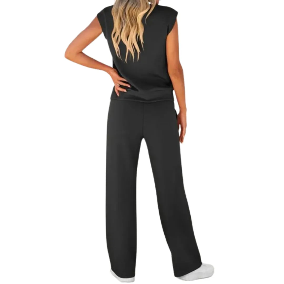 Black cap sleeve two-piece trouser set styled on standing model
