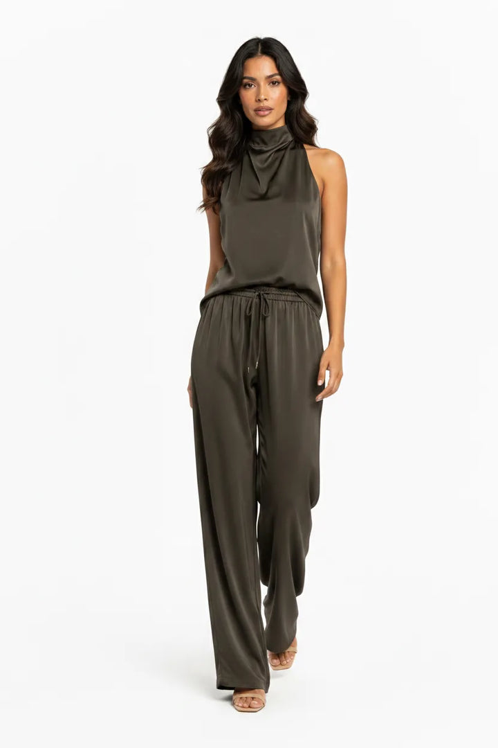 Black halter top and wide-leg trouser set on model in natural movement
