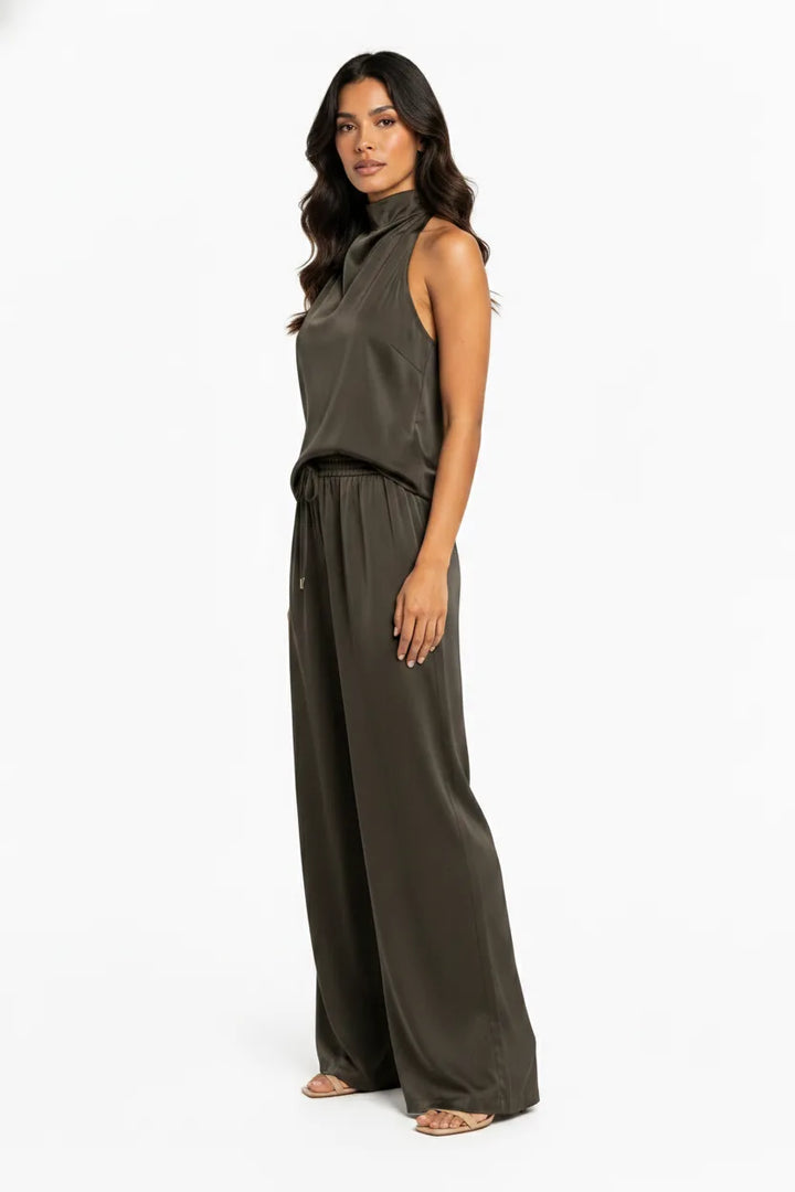 Black halter top and wide-leg trouser set on model in three-quarter turn