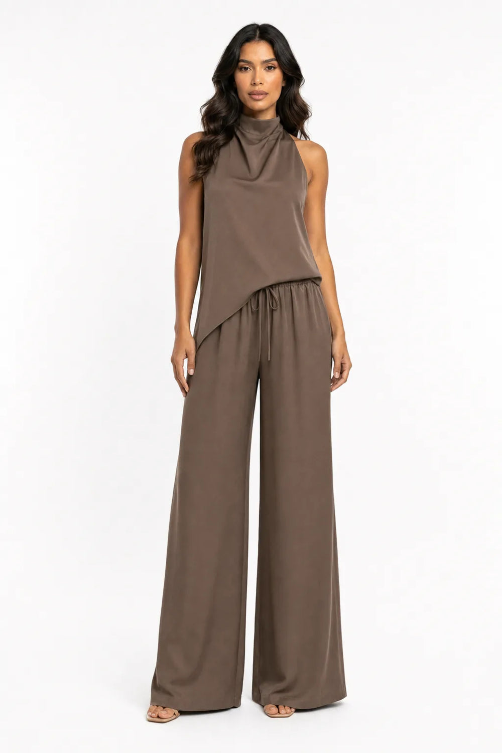 Brown halter top and wide-leg trouser set on model in contrapposto stance