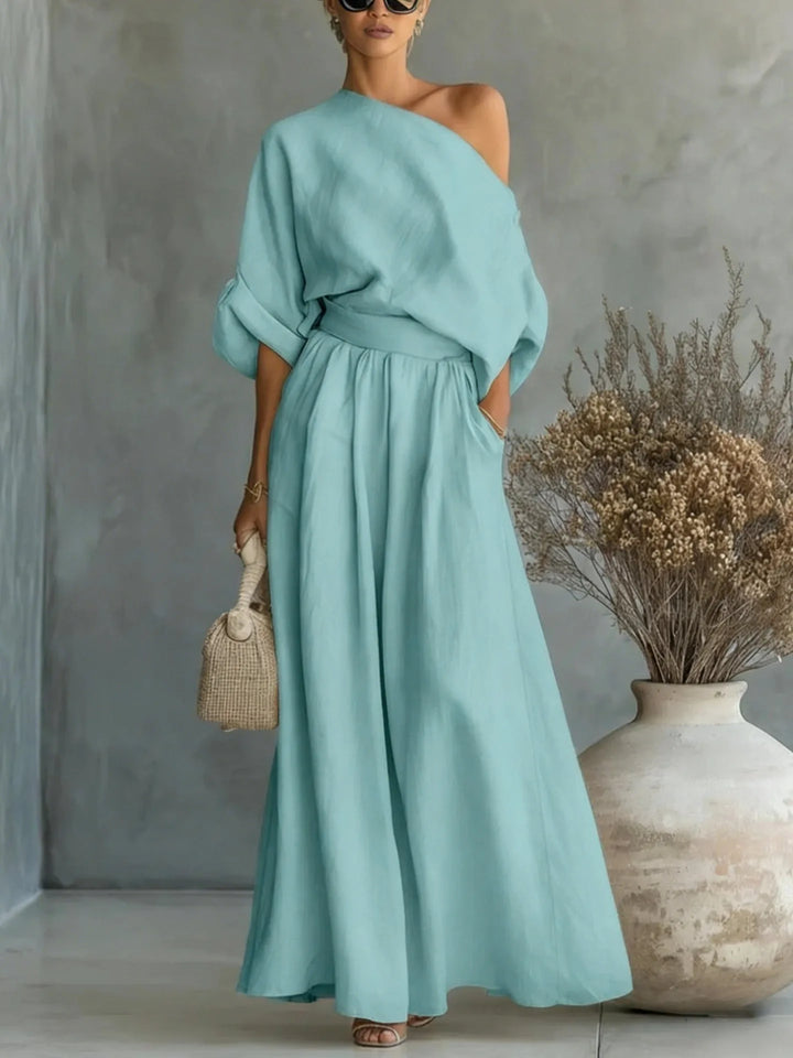 Blue off-shoulder crop top and wide-leg trouser set on standing model