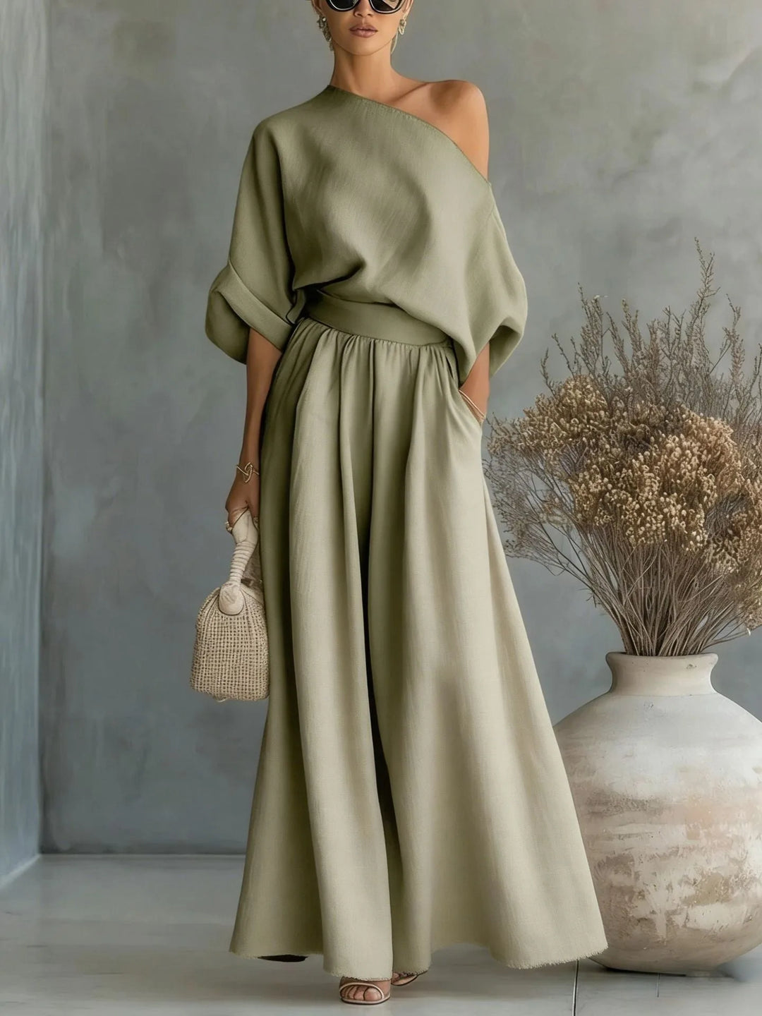 Green off-shoulder crop top and wide-leg trouser set on standing model