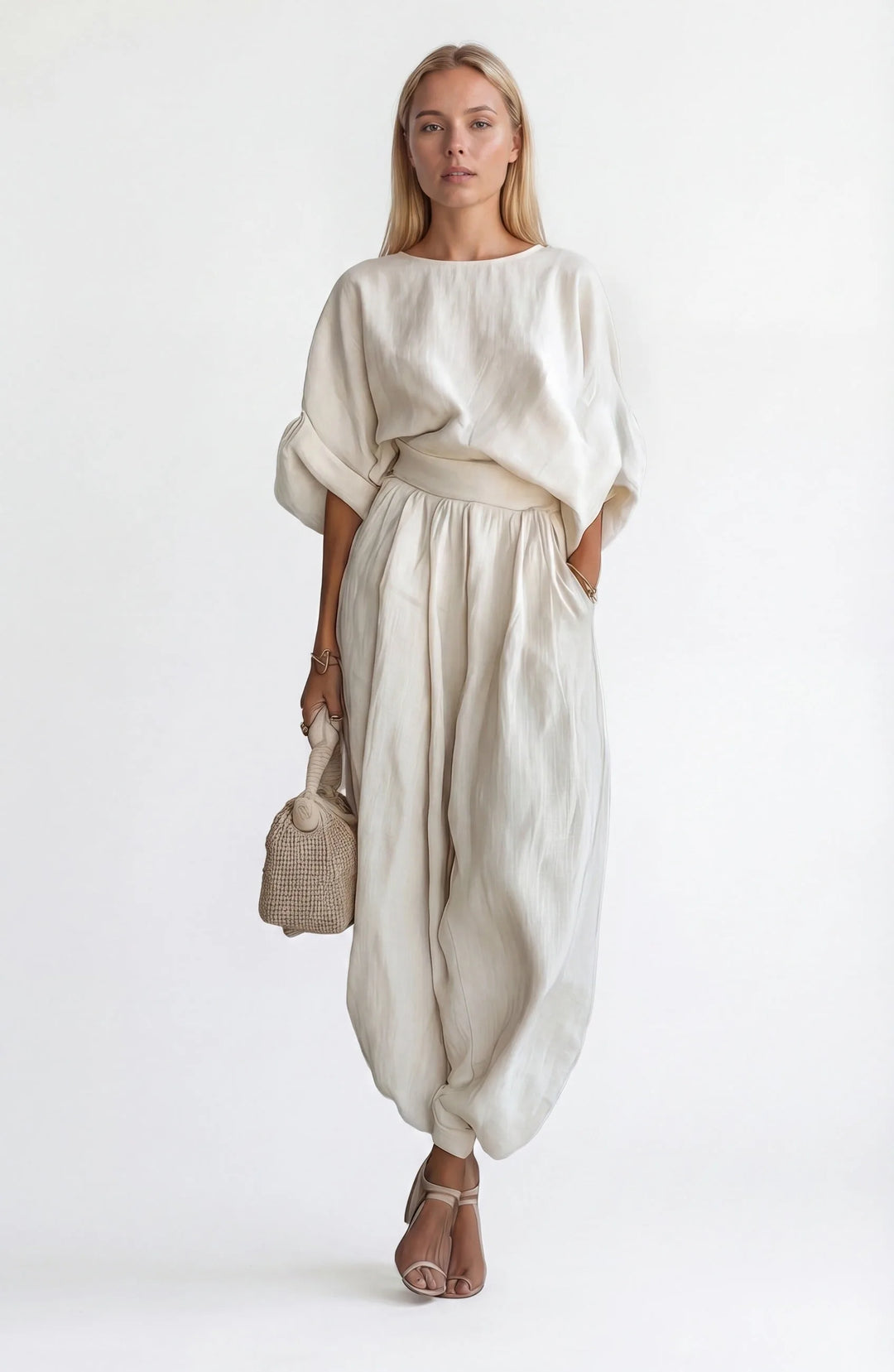 White off-shoulder crop top and wide-leg trouser set, model facing forward