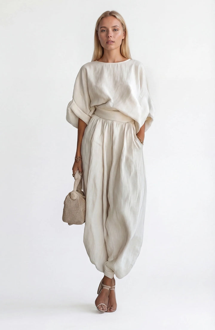 White off-shoulder crop top and wide-leg trouser set, model facing forward