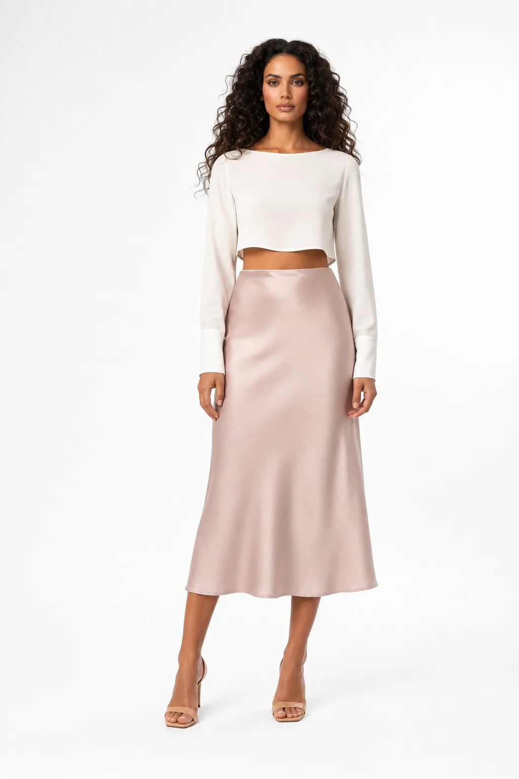 Pink satin midi skirt on model in contrapposto stance