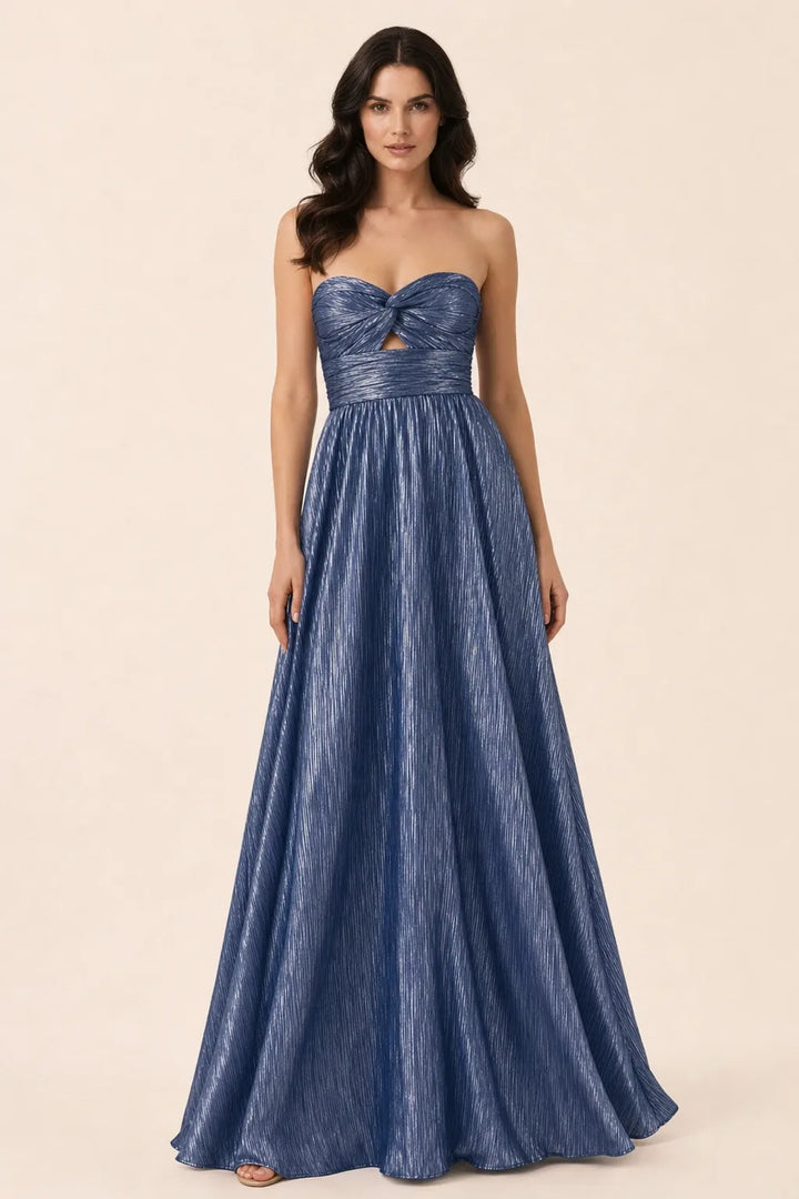 Blue twist front floor-length gown on model in contrapposto stance