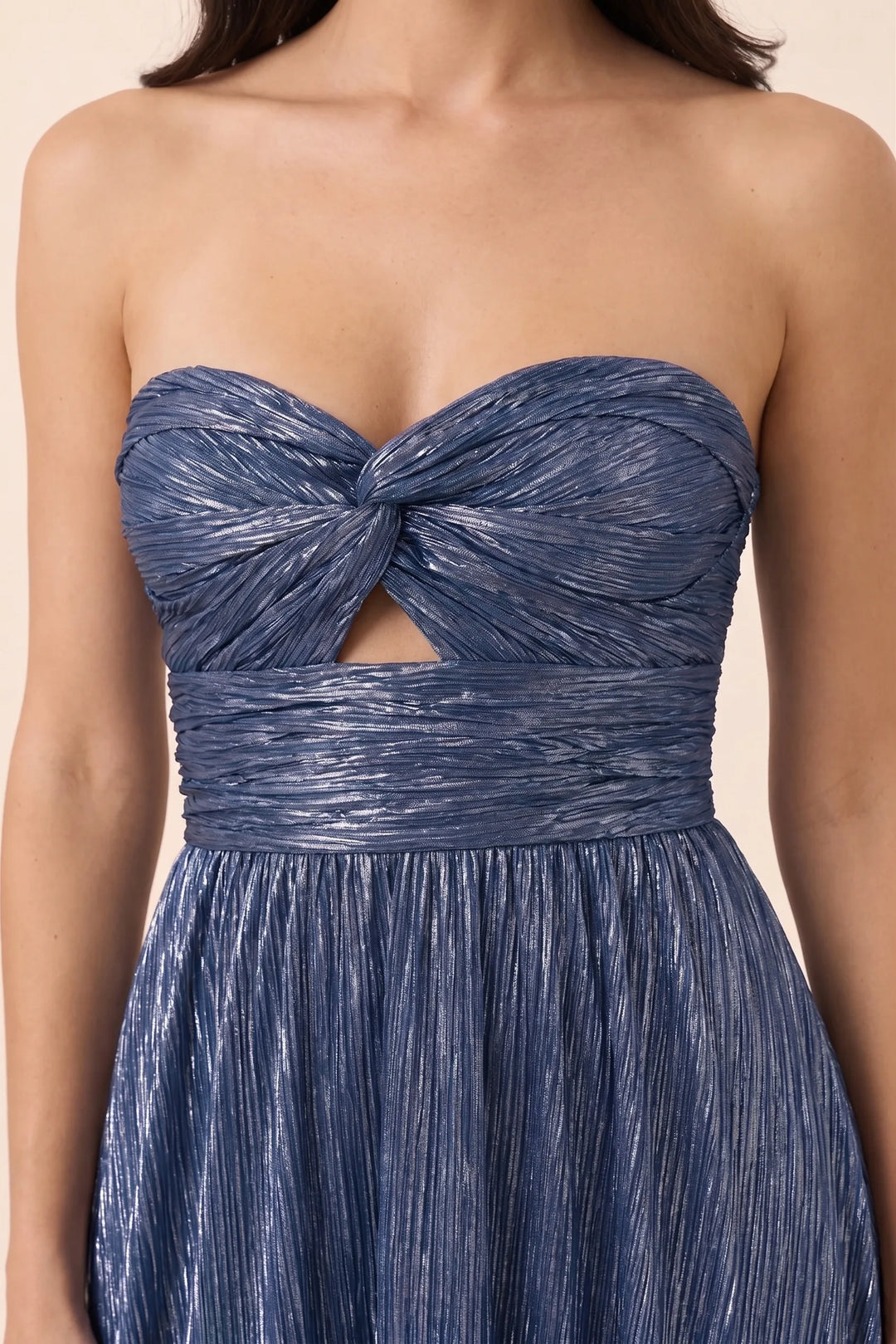 Close-up detail of twisted front bodice on blue floor-length gown