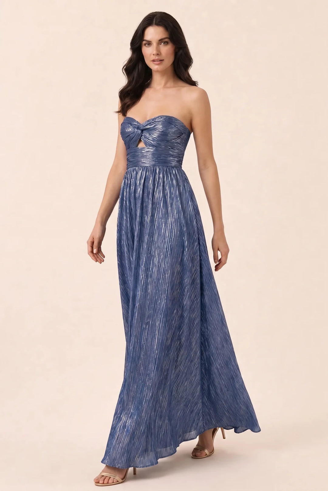 Blue twist front floor-length gown on model in three-quarter turn
