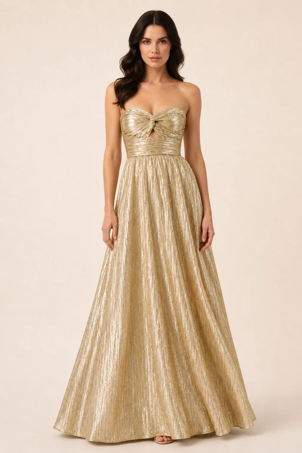 Gold twist front floor-length gown on model in contrapposto stance