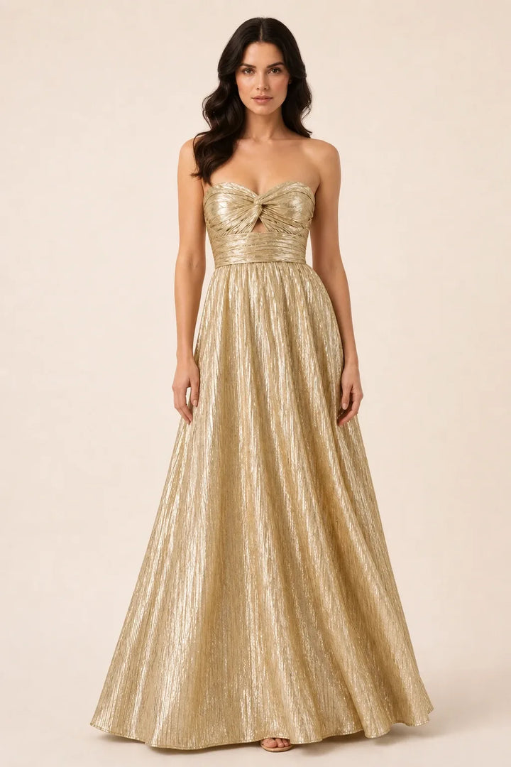 Gold twist front floor-length gown on model in contrapposto stance