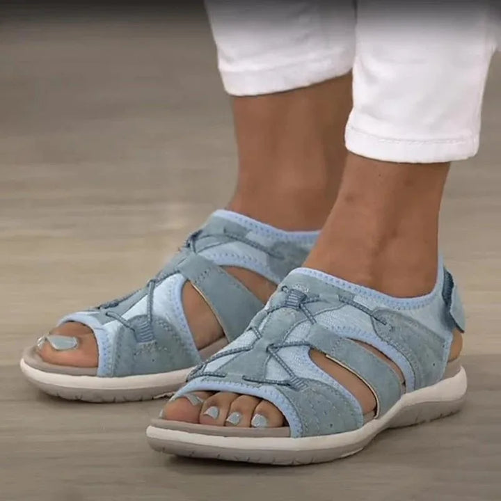 Blue velcro strap cutout sandal, side profile view