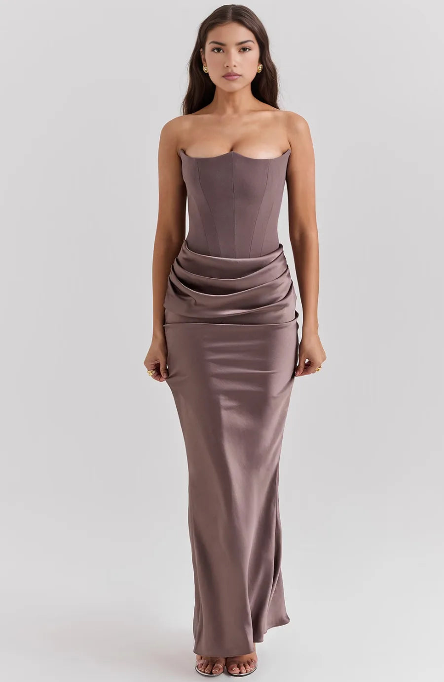 Brown corset maxi gown on model at three-quarter turn