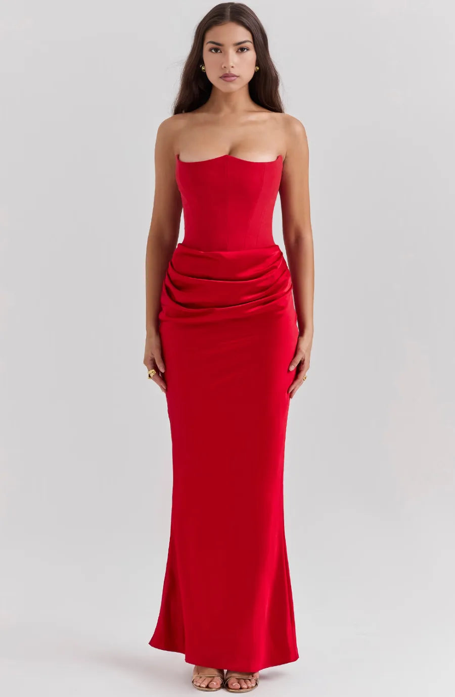 Close-up detail of red corset maxi gown boning and lace-up bodice