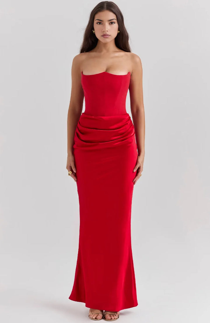 Close-up detail of red corset maxi gown boning and lace-up bodice