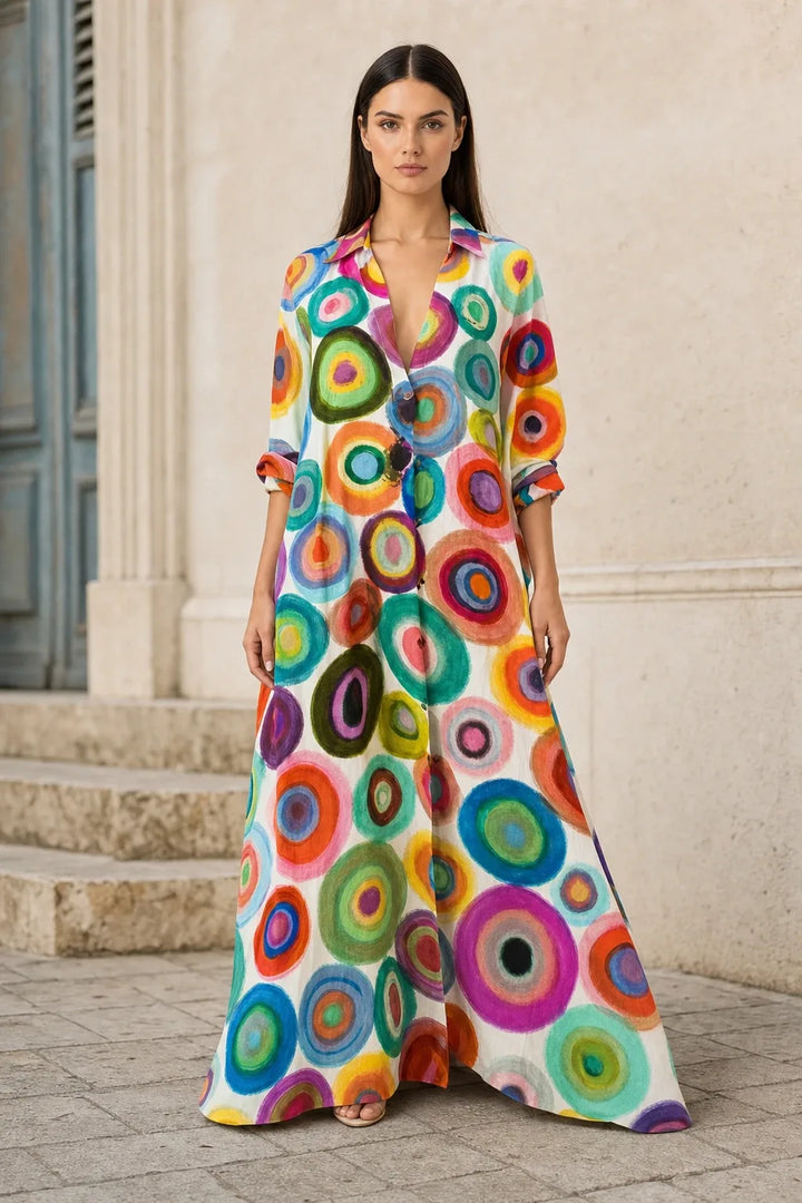 Multicolor circle-print tiered maxi dress on model in contrapposto stance