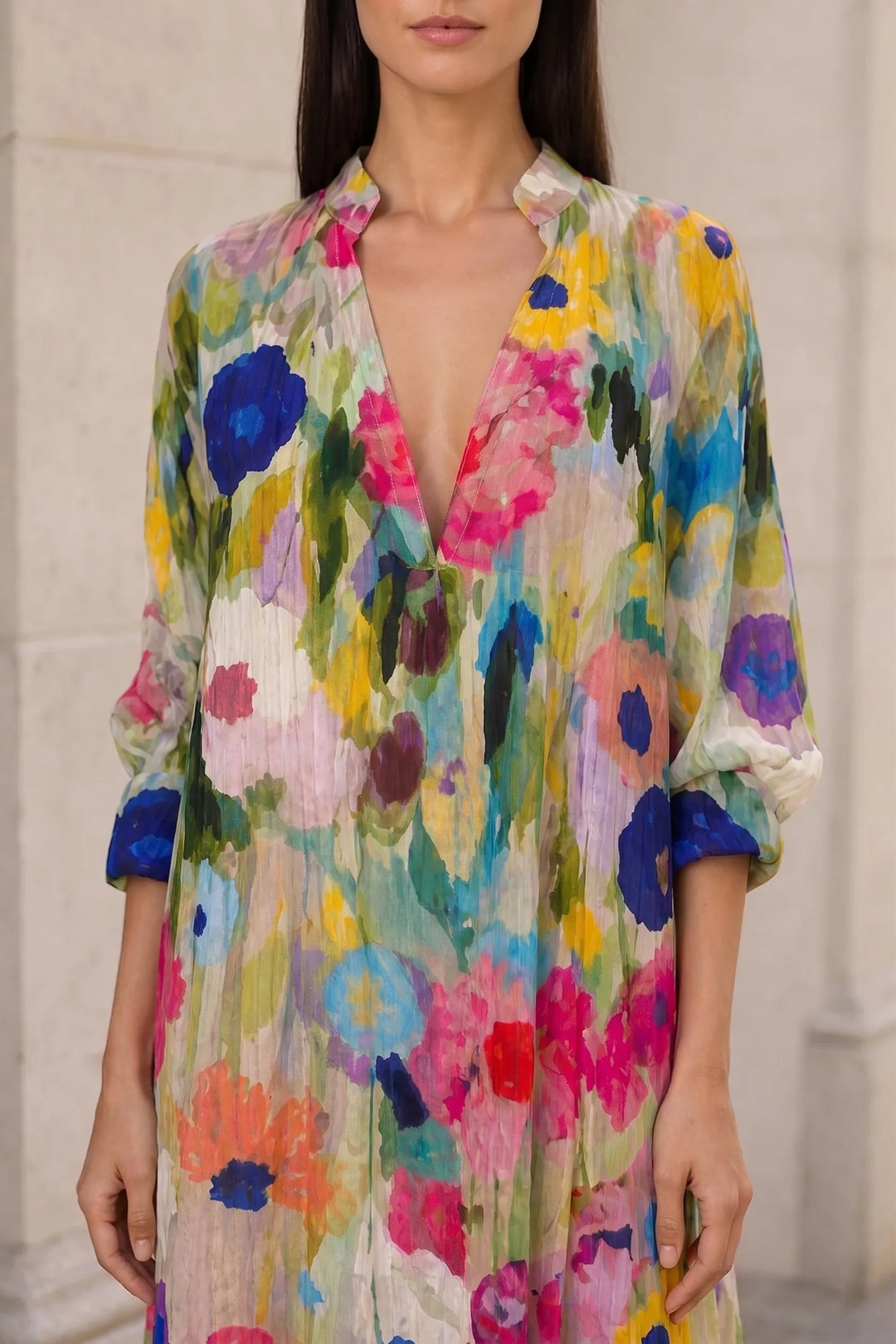 Close-up detail of multicolor floral tiered maxi dress fabric and tiers