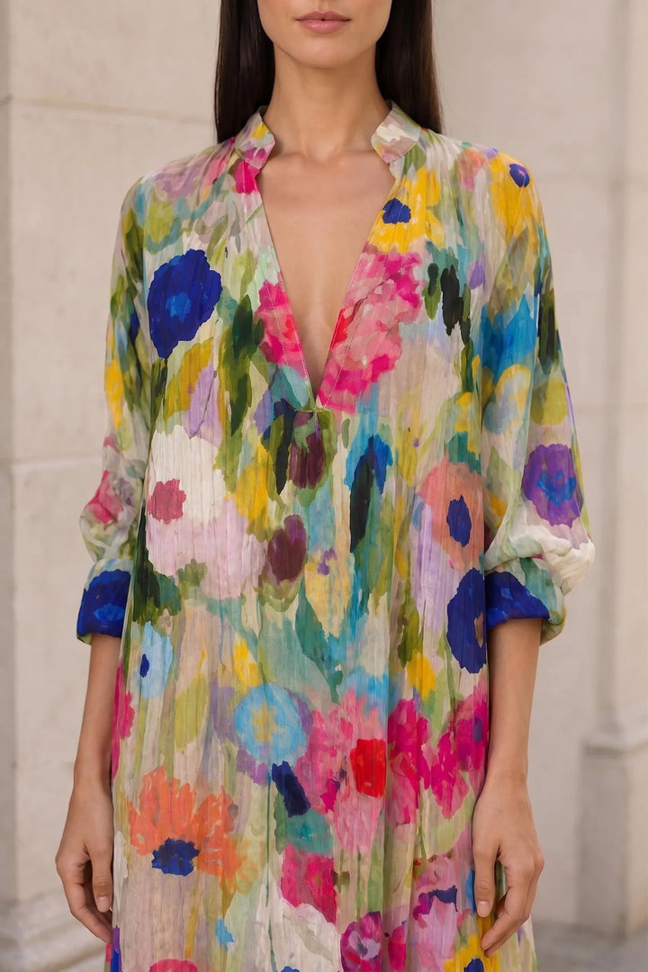 Close-up detail of multicolor floral tiered maxi dress fabric and tiers