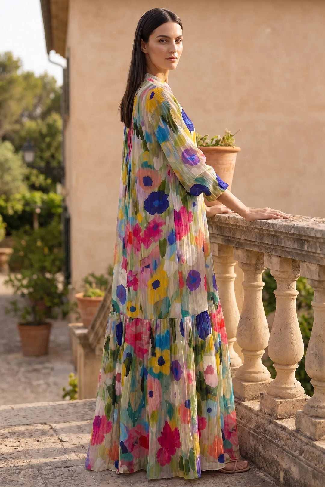 Model wearing multicolor floral tiered maxi dress in lifestyle setting