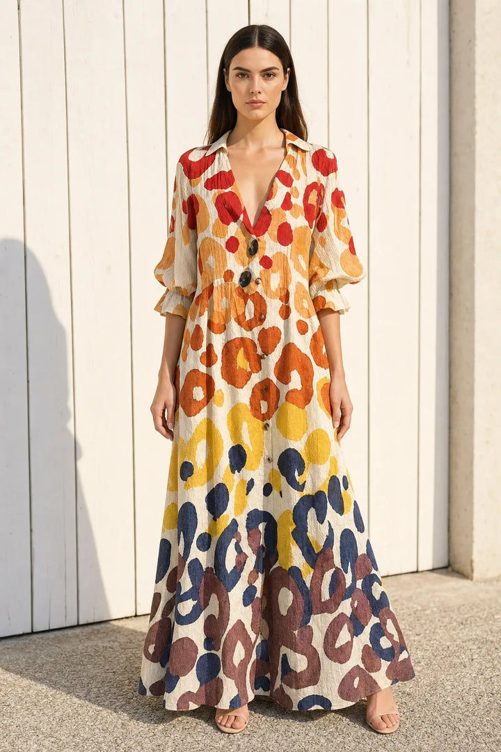 Yellow floral tiered maxi dress on model in contrapposto stance