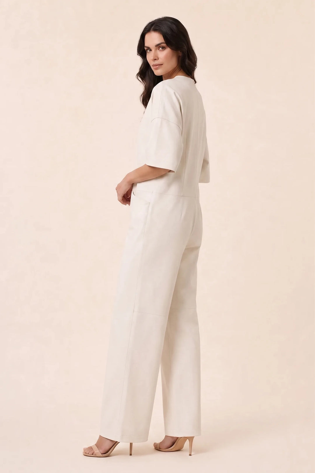 White wide-leg jumpsuit on model in three-quarter turn