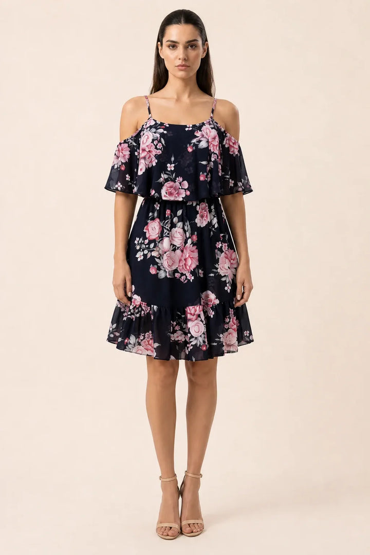 Black cold shoulder ruffle mini dress on model in contrapposto stance