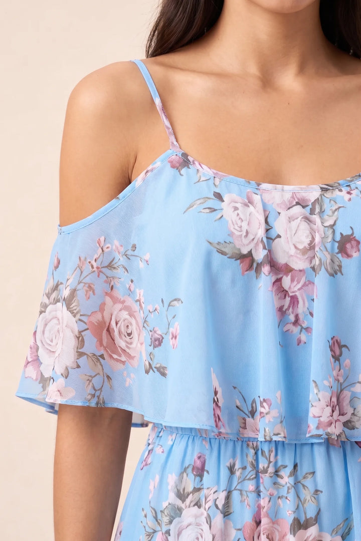 Close-up detail of light blue cold shoulder ruffle mini dress