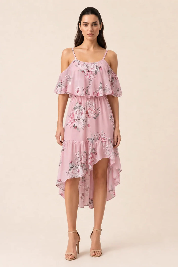 Pink cold shoulder ruffle mini dress on model in contrapposto stance