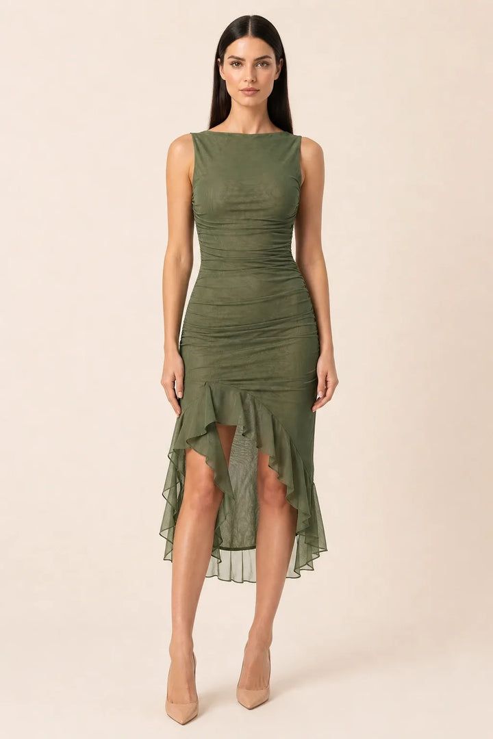 Green ruched ruffle midi dress on model in contrapposto stance