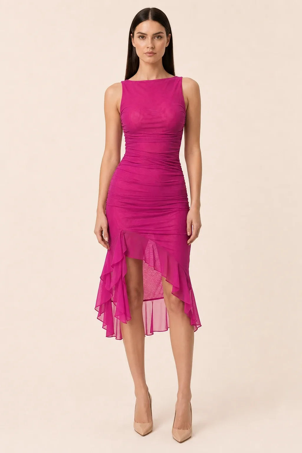Pink ruched ruffle midi dress on model in contrapposto stance