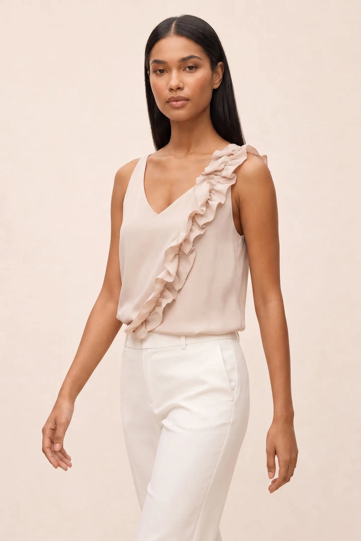 Beige asymmetric ruffle cami on model in three-quarter turn
