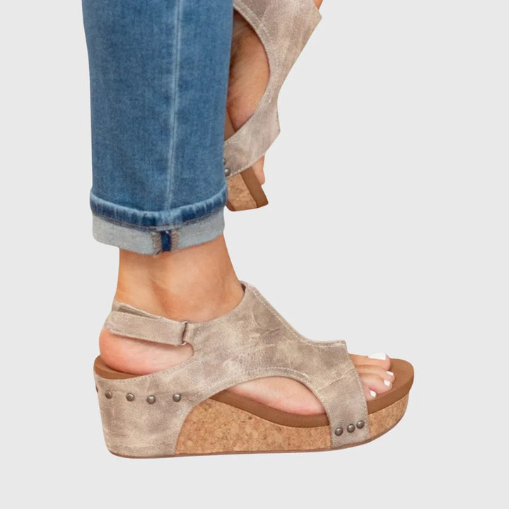Beige wedge platform sandal heel view showing back strap and wedge structure