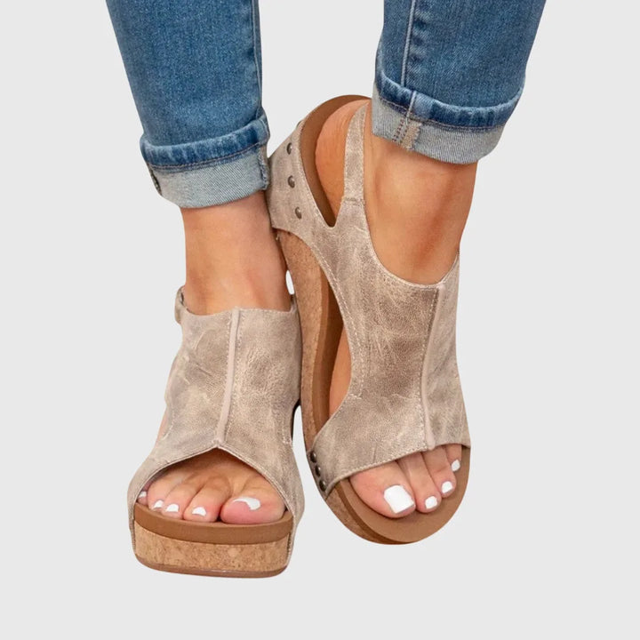 Beige wedge platform sandal side profile highlighting wedge height and sole