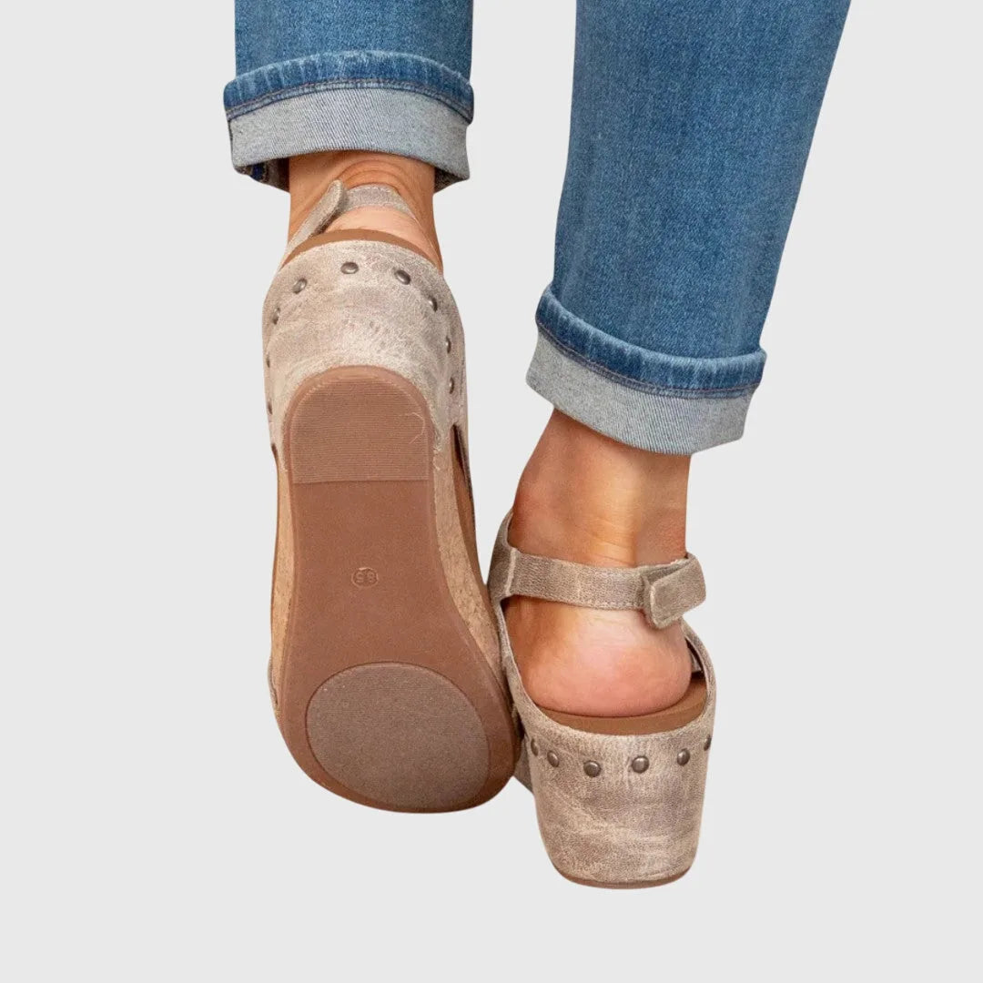 Beige wedge platform sandal three-quarter view showing straps and platform