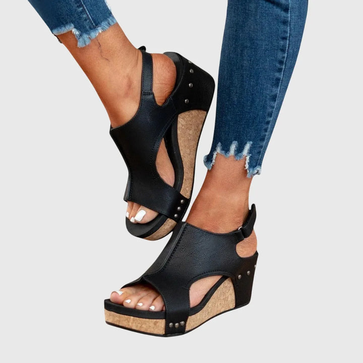 Beige wedge platform sandal view showcasing strap detailing and platform base