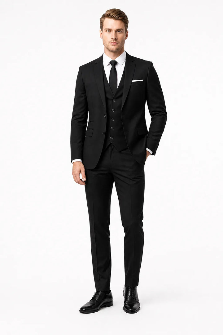 Slim black three-piece suit on male model in contrapposto stance