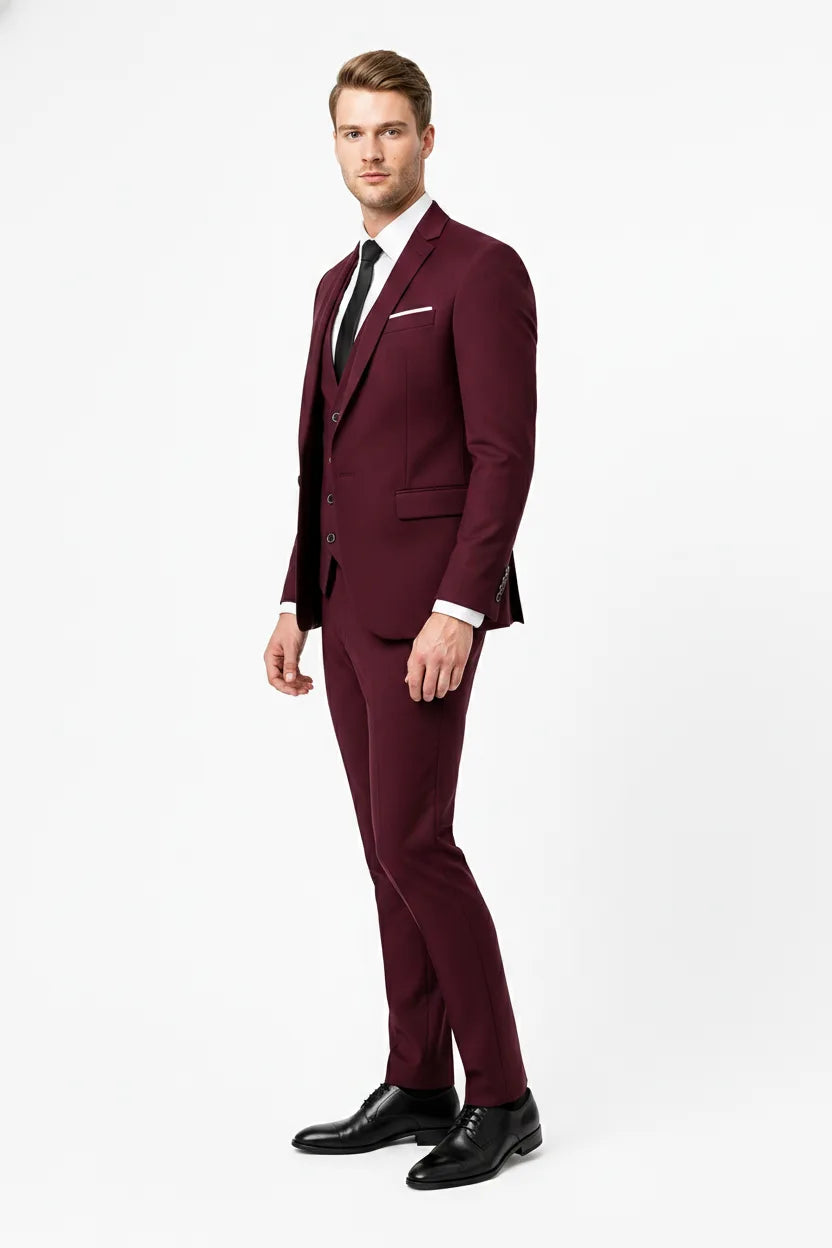 Slim burgundy three-piece suit on male model in three-quarter turn