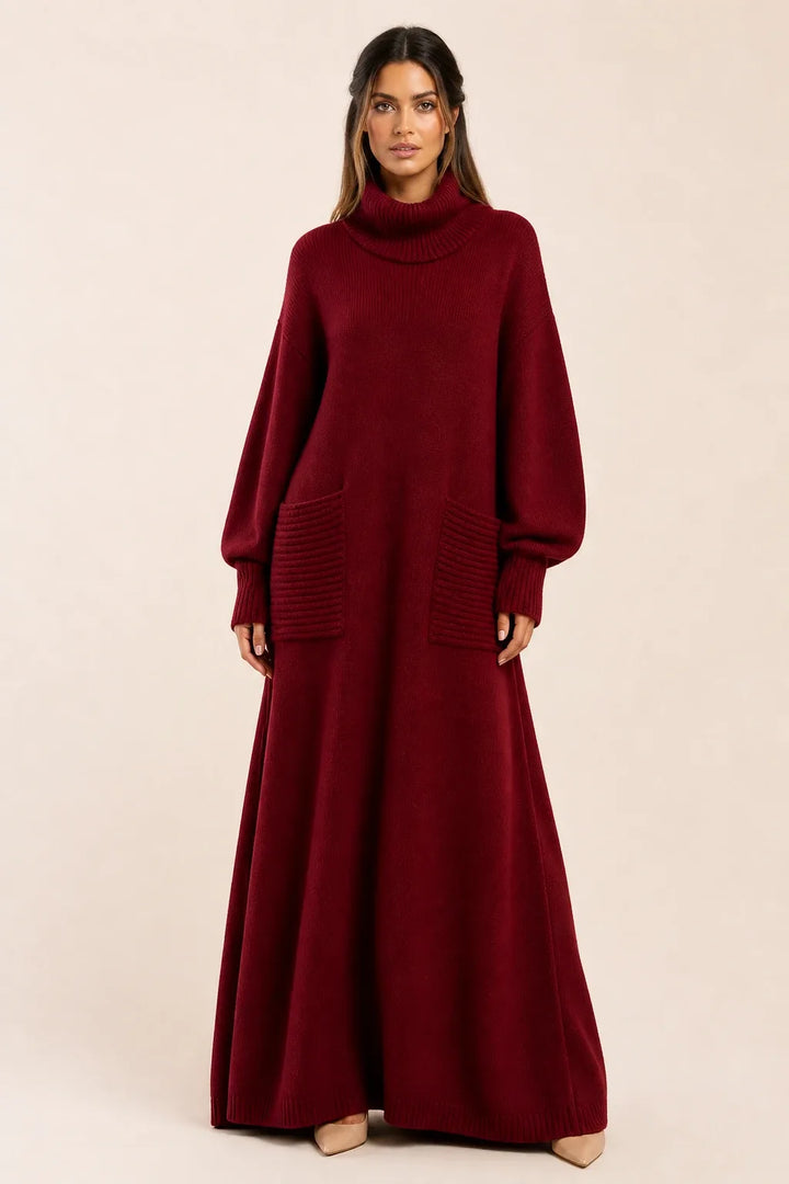 Burgundy ribbed turtleneck sweater maxi dress on model in contrapposto stance