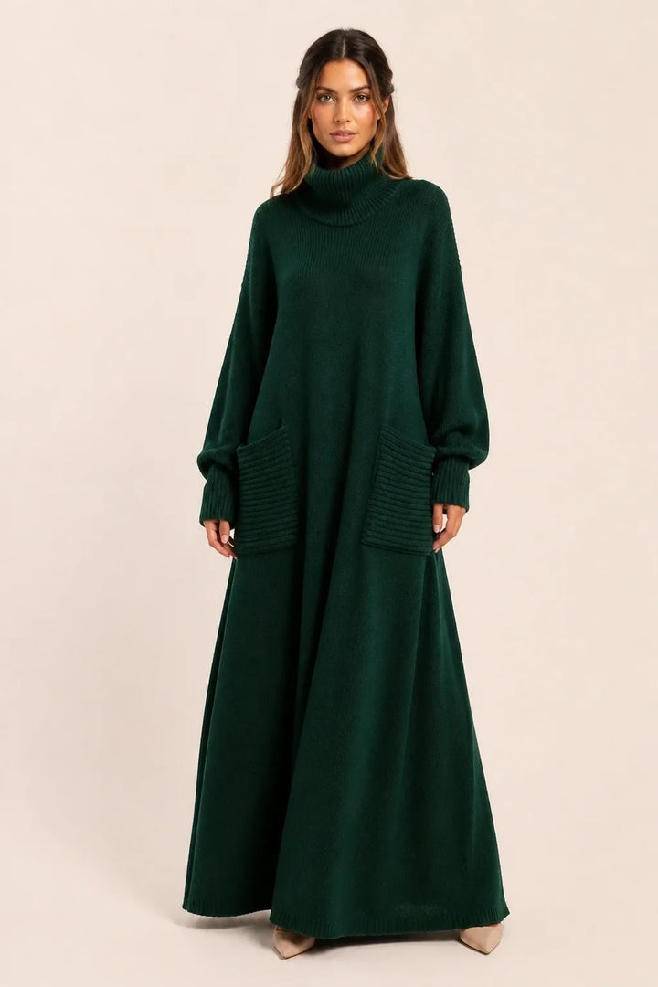 Green ribbed turtleneck sweater maxi dress on model in contrapposto stance