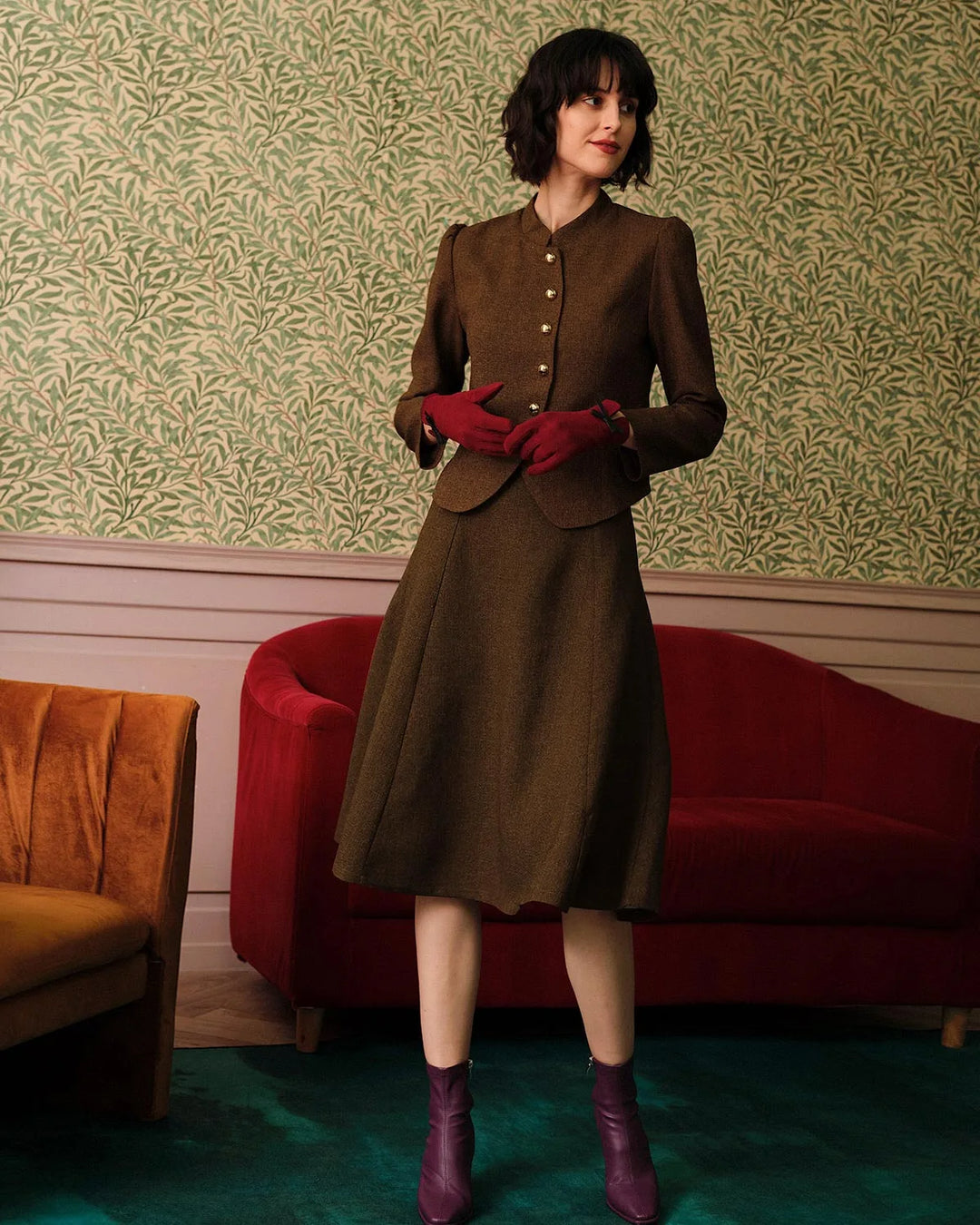 Brown pleated A-line midi skirt on model, full-length view