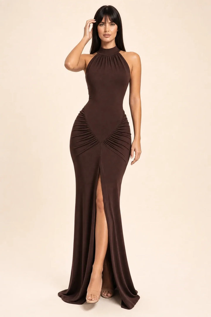 Brown ruched halter gown on model in contrapposto stance, floor-length silhouette