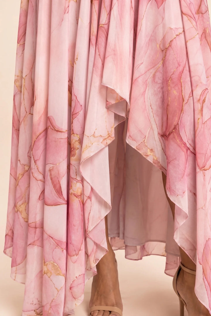 Close-up of ruching detail on a pink high-low maxi dress