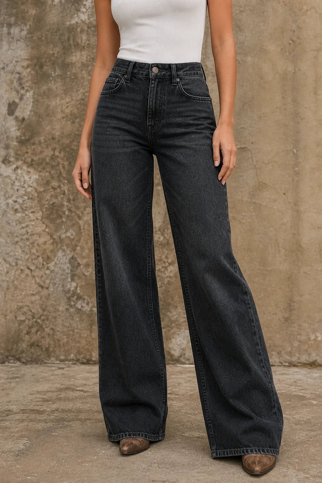Black wide-leg flare jeans on a model in a contrapposto stance