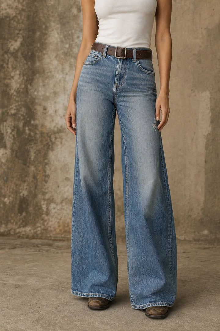 Light blue wide-leg flare jeans on a model in a contrapposto stance